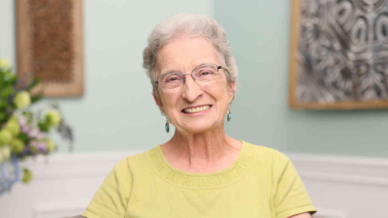 portrait image of dixie after full-arch restoration
