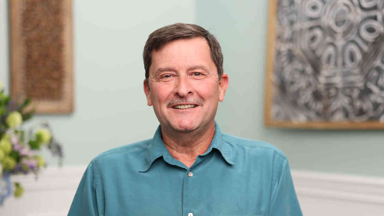portrait image of tony after full-arch restoration