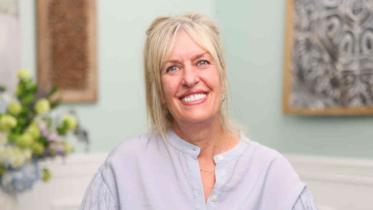 portrait image of tracy after dental implants
