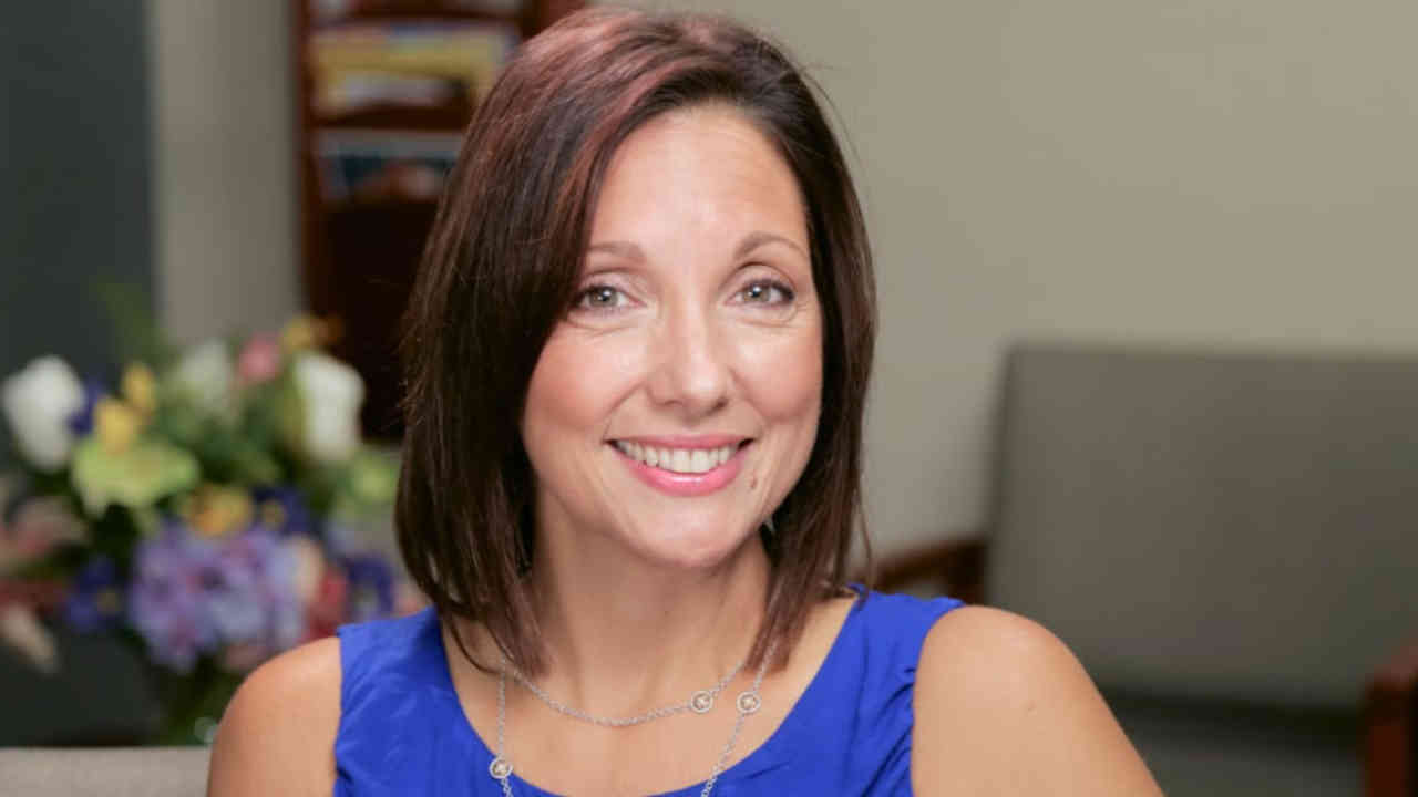 portrait image of ana maria after dental implants