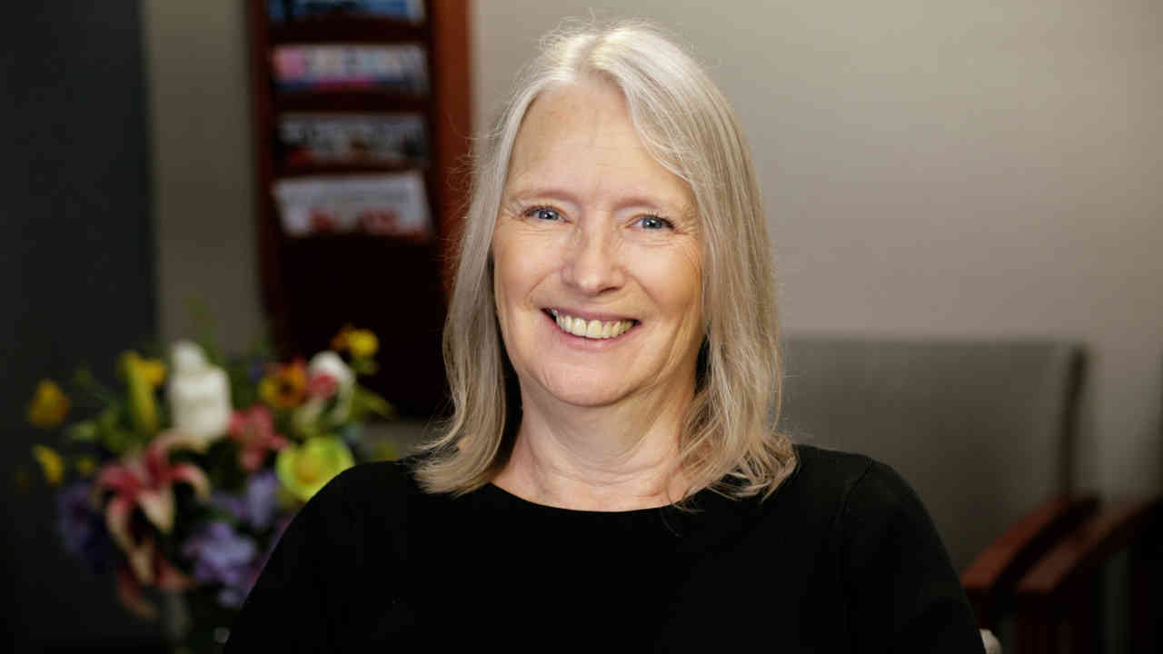 portrait image of belinda after dental implants