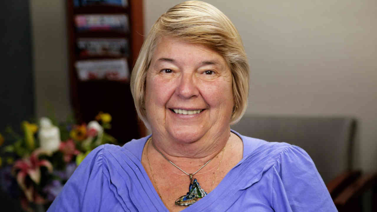 portrait image of brenda after dental implants