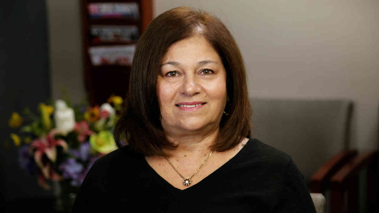 portrait image of carol after dental implants