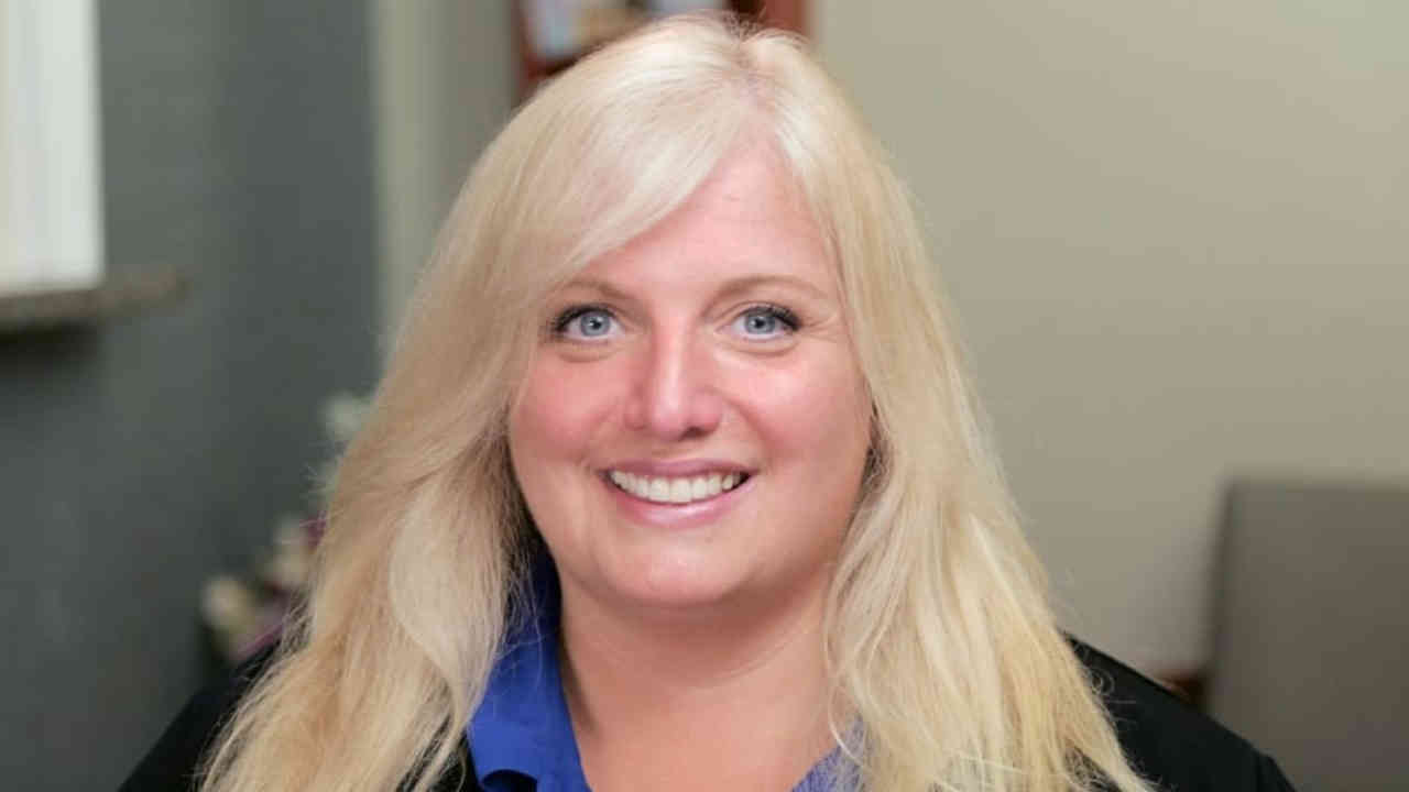 portrait image of debbie after dental implants