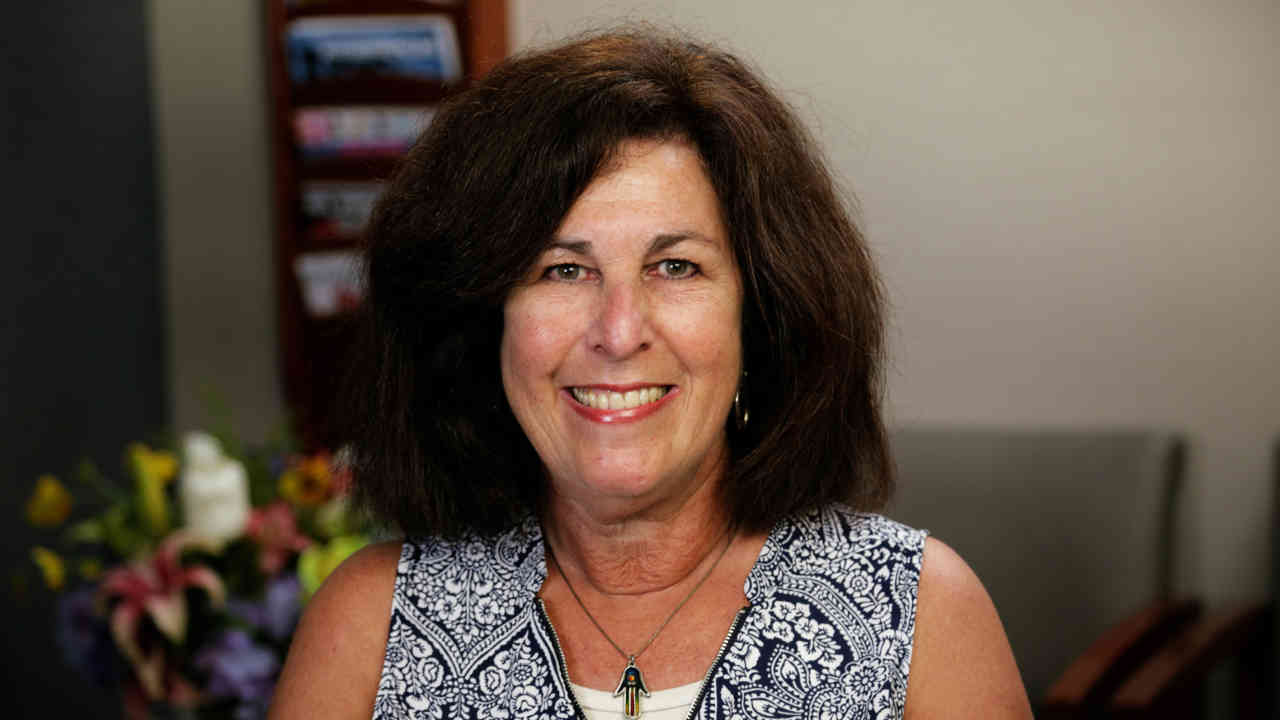 portrait image of ellen after dental implants