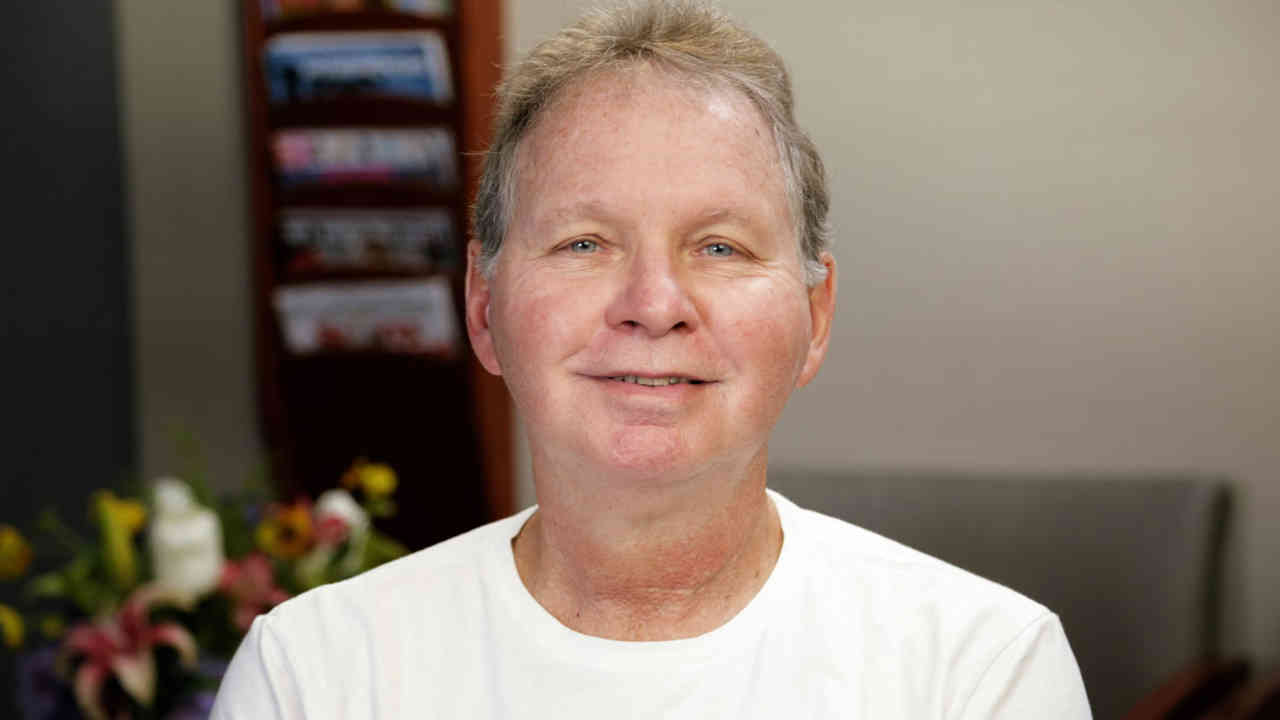 portrait image of ken after dental implants