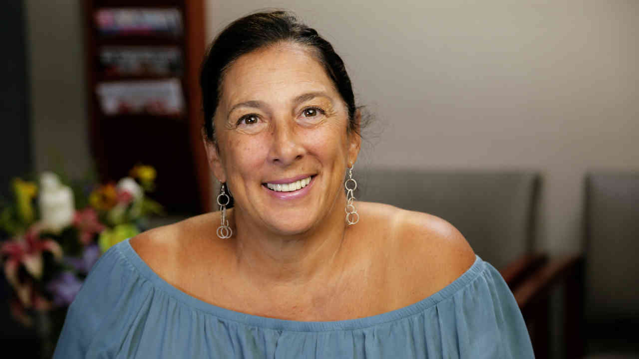 portrait image of susan after dental implants