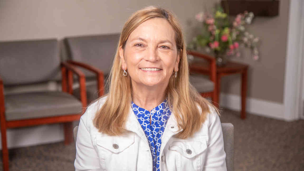 portrait image of susan after dental implants