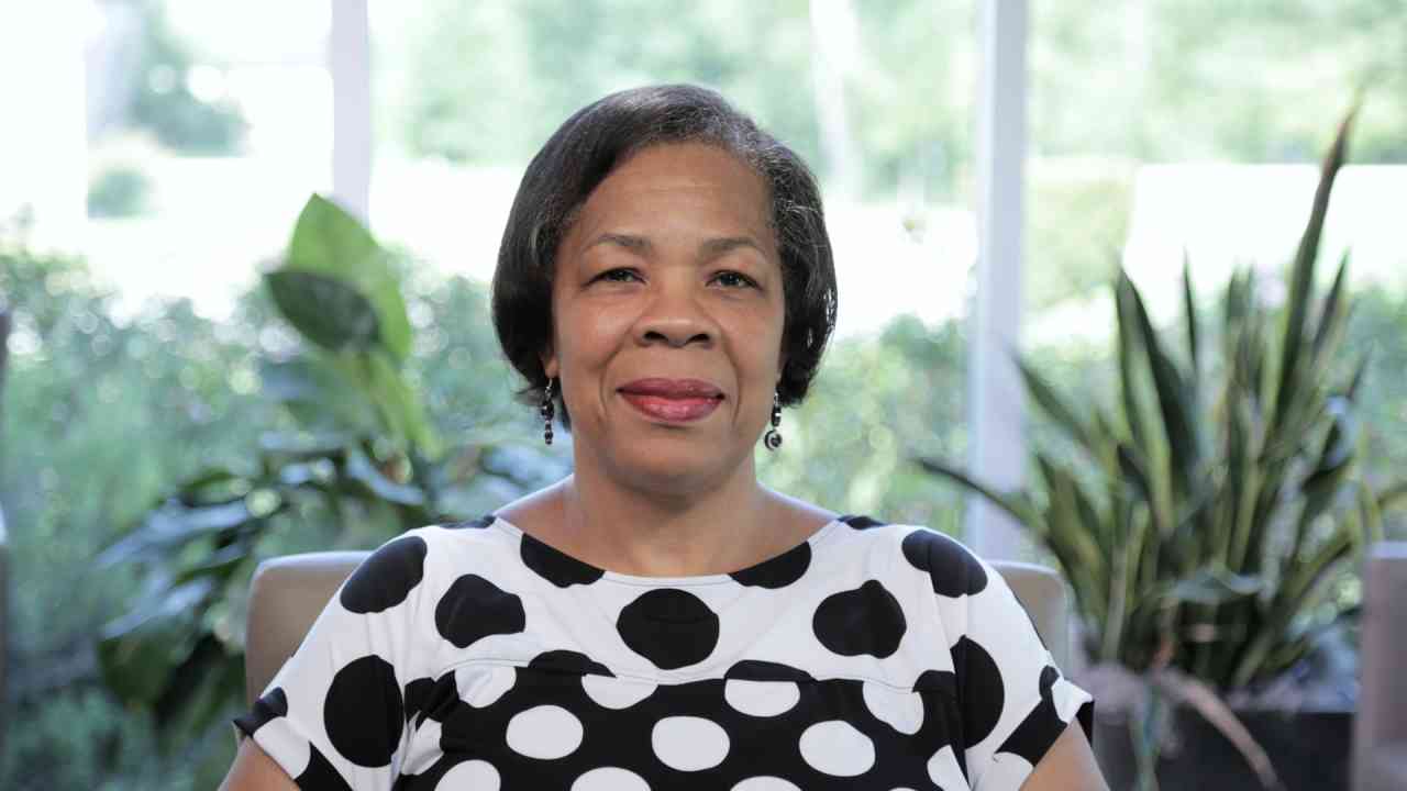 portrait image of delores after dental implants