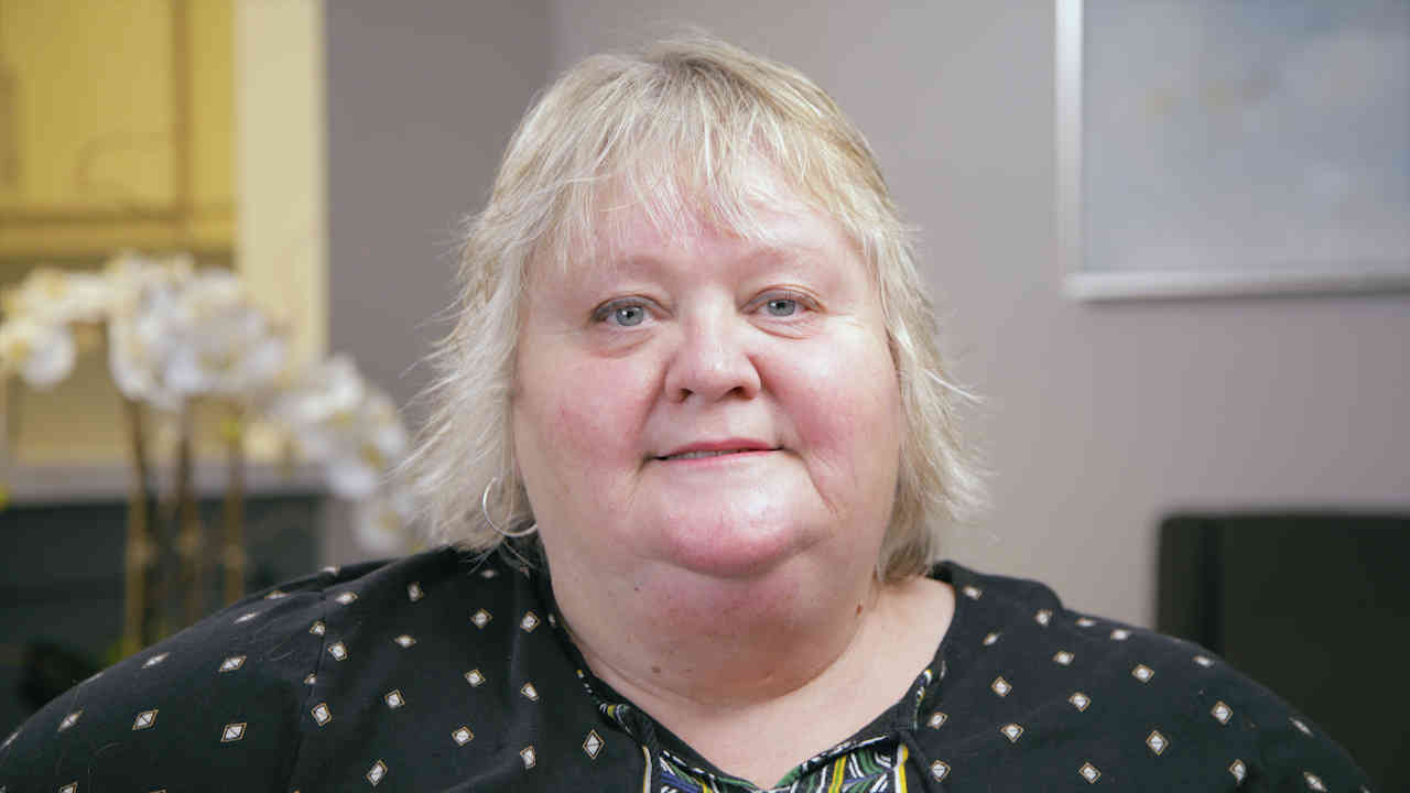 portrait image of Debbie after Tooth Extraction
