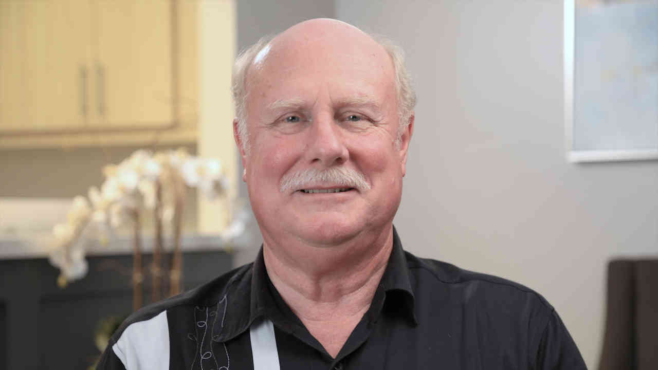 portrait image of Paul after Dental Implants