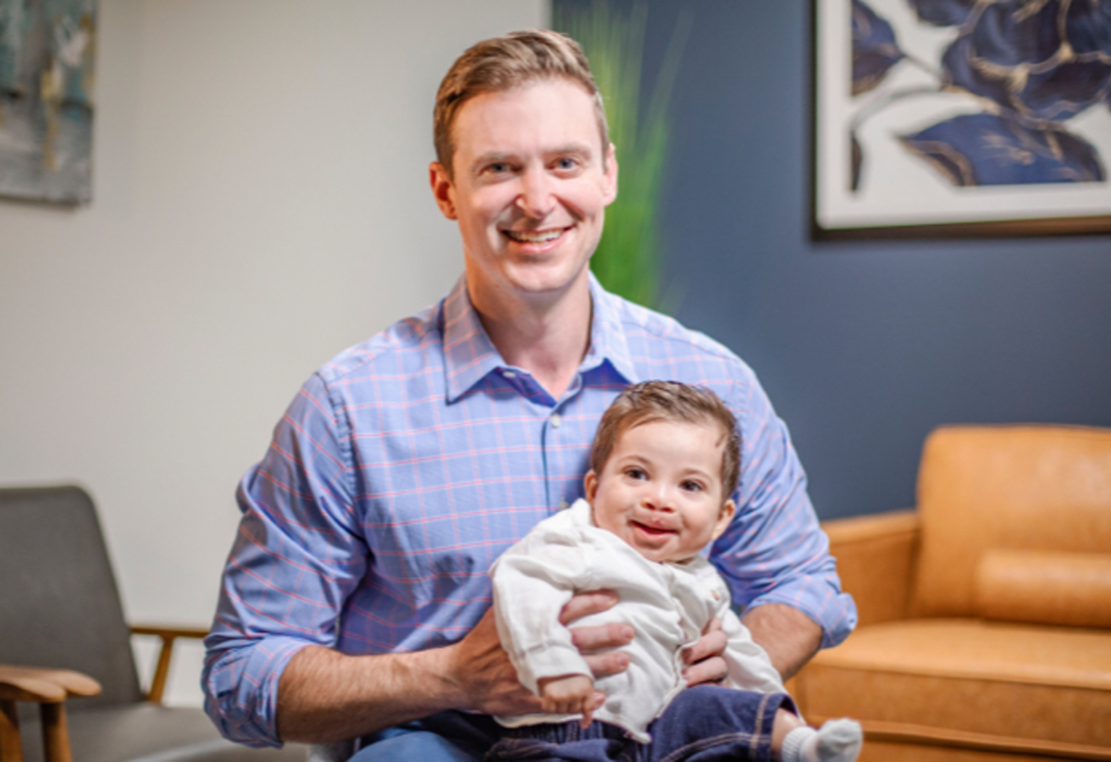 Dr. Galea with a  infant craniofacial patient