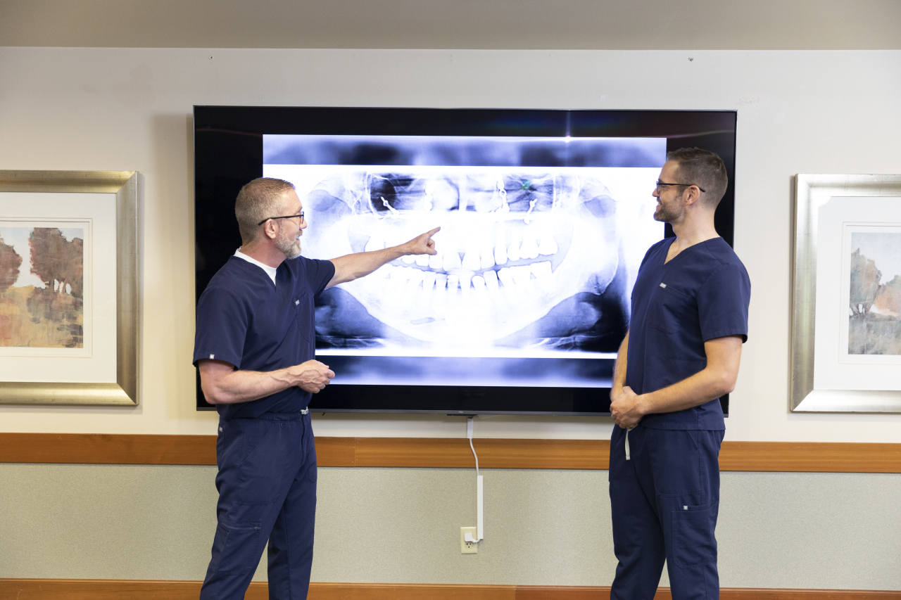 oral surgeons in missoula montana looking at xray