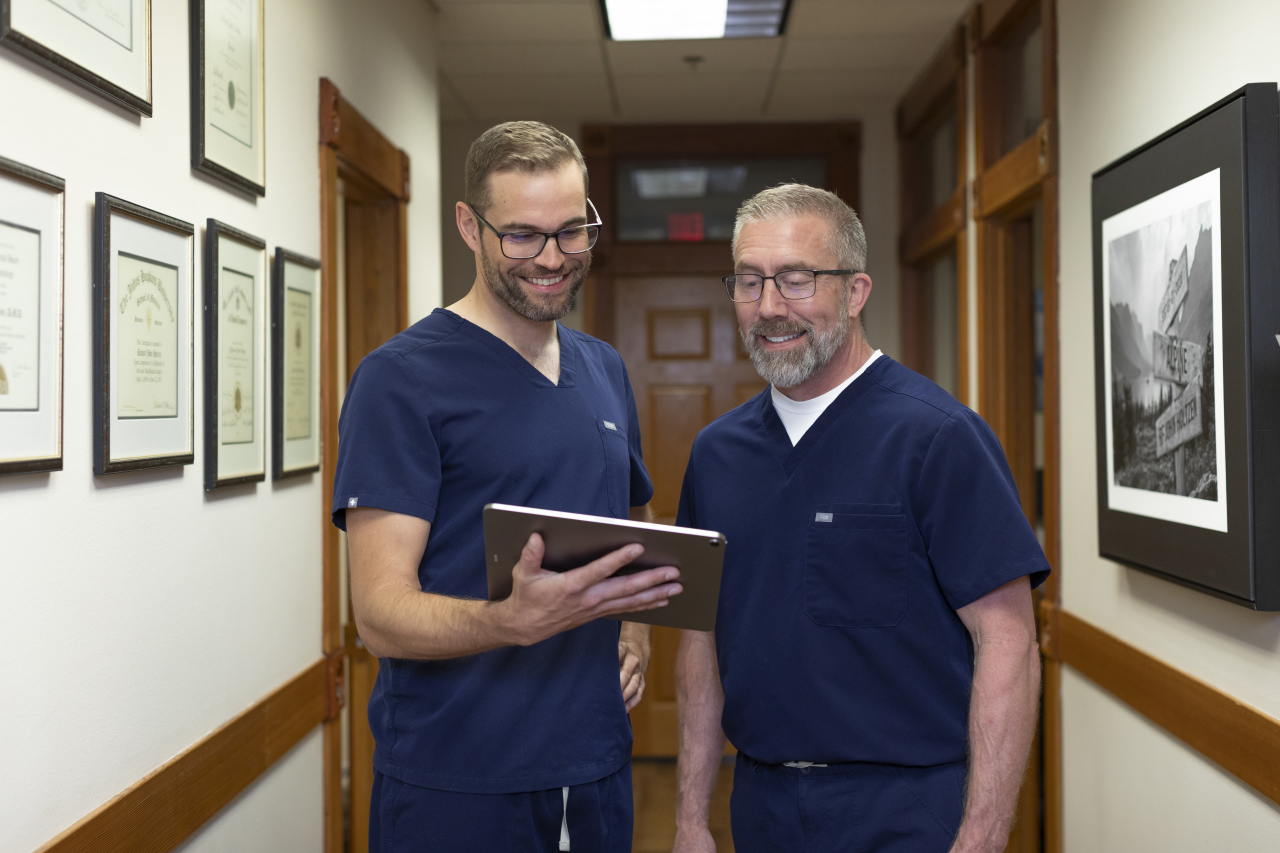 oral surgeons in missoula montana looking at ipad