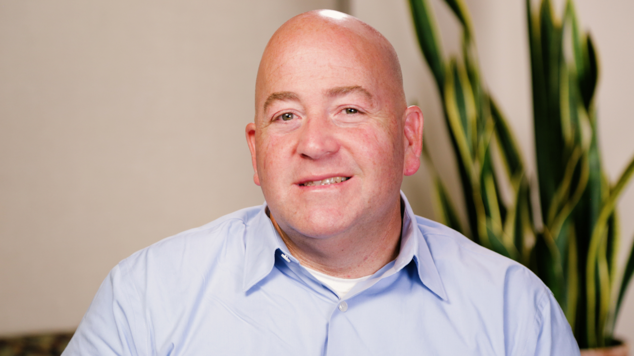 portrait image of dan after dental implants