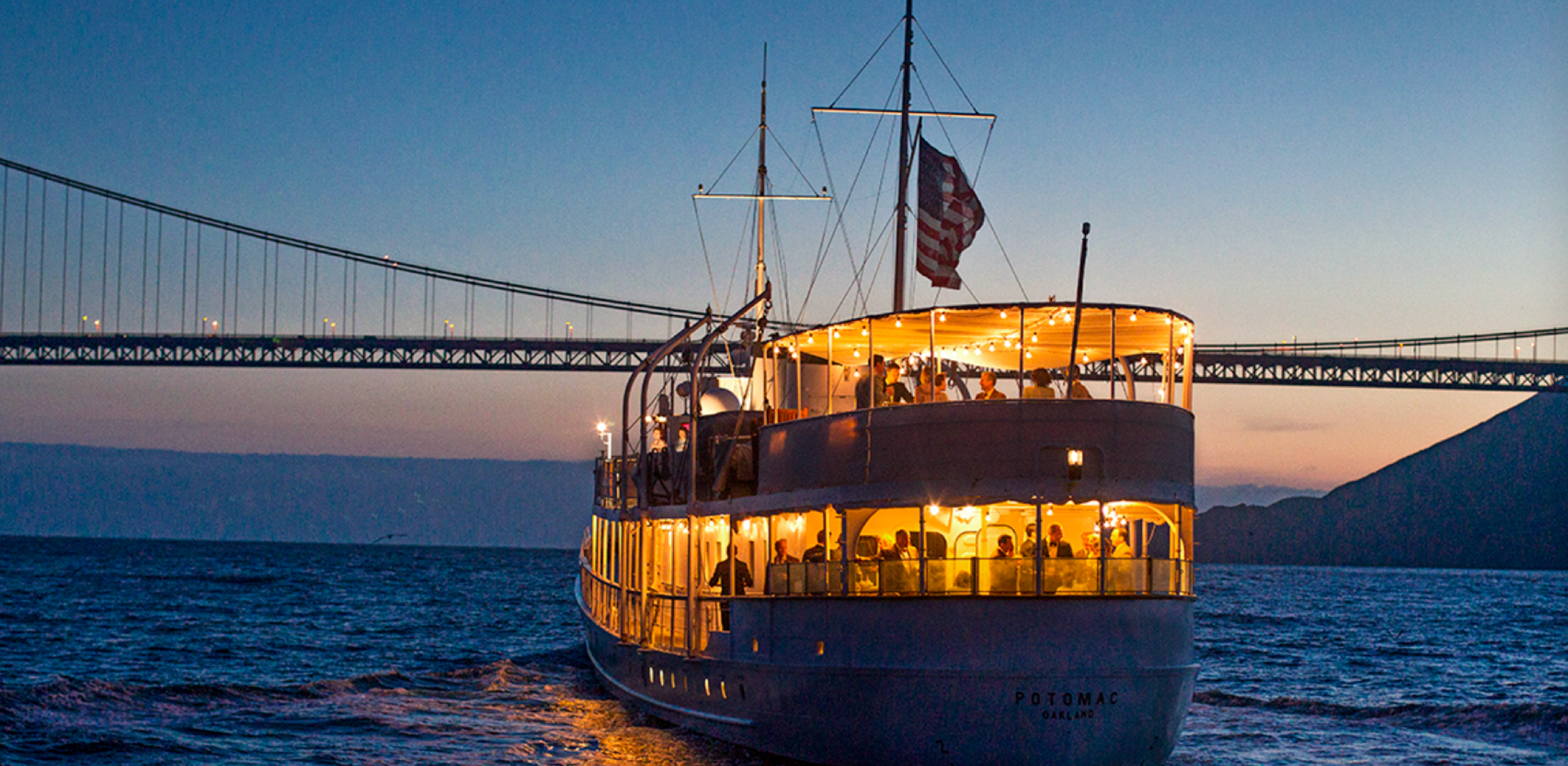 USS Potomac sailing under the Golden Gate Bridge