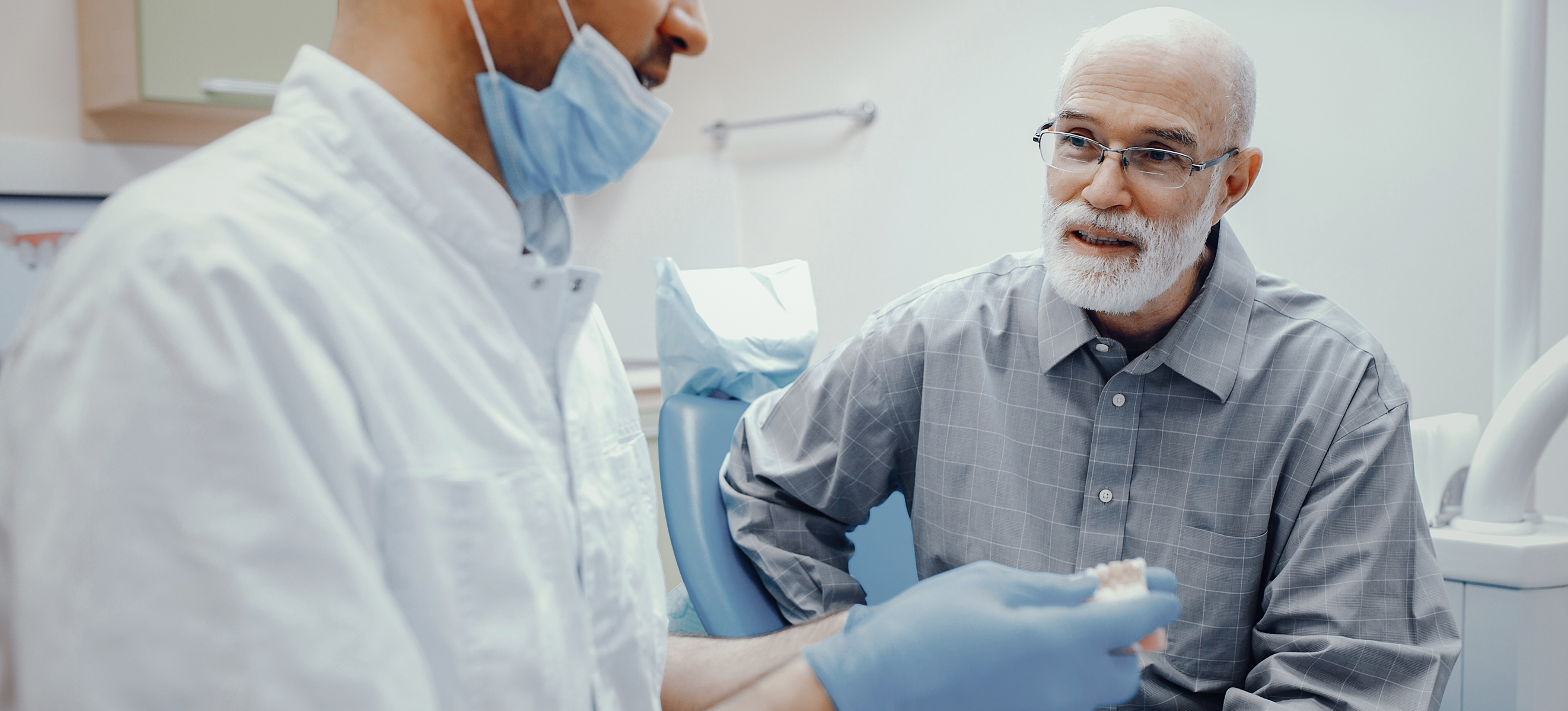 dentist and patient discussing wisdom teeth removal