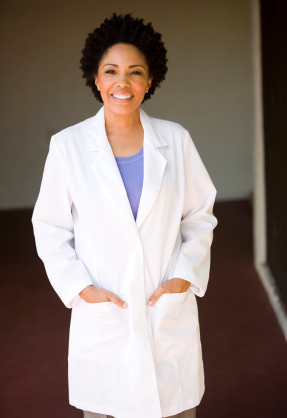 A woman dentist smiling happily.