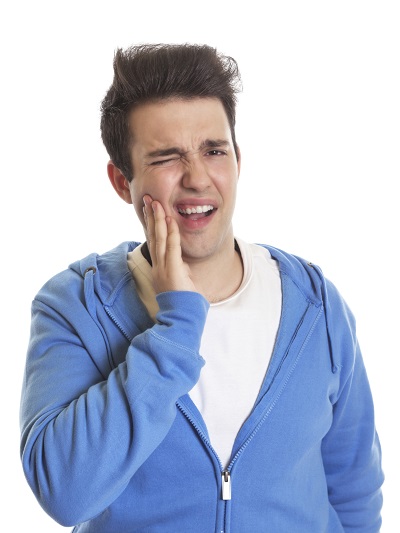 A man suffering from tooth pain after he has fallen.