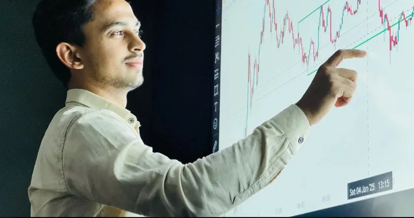 Analyst reviewing stock price chart on best trading app display screen during market analysis session.
