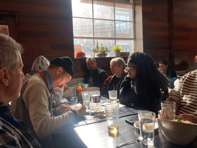 People sitting and talking around the table