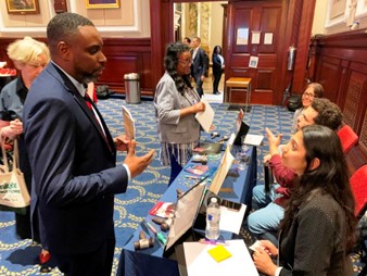 Attendees speak with volunteer organizations