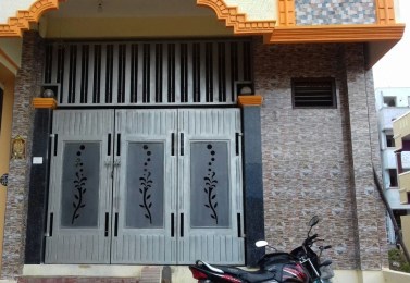 Laser-cut main gate and wicket door installed at a residence