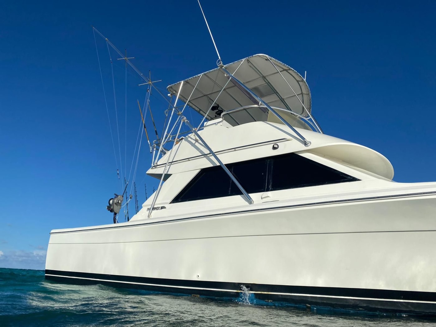 Sport-fishing boat trolling lines offshore