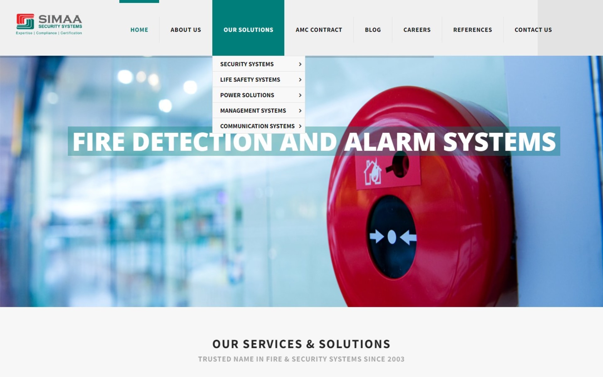 WordPress website for Simaa Security Systems, a Dubai ELV integrator, Our Solutions menu: security, life safety, power, management and communication systems, each with its own fly-out