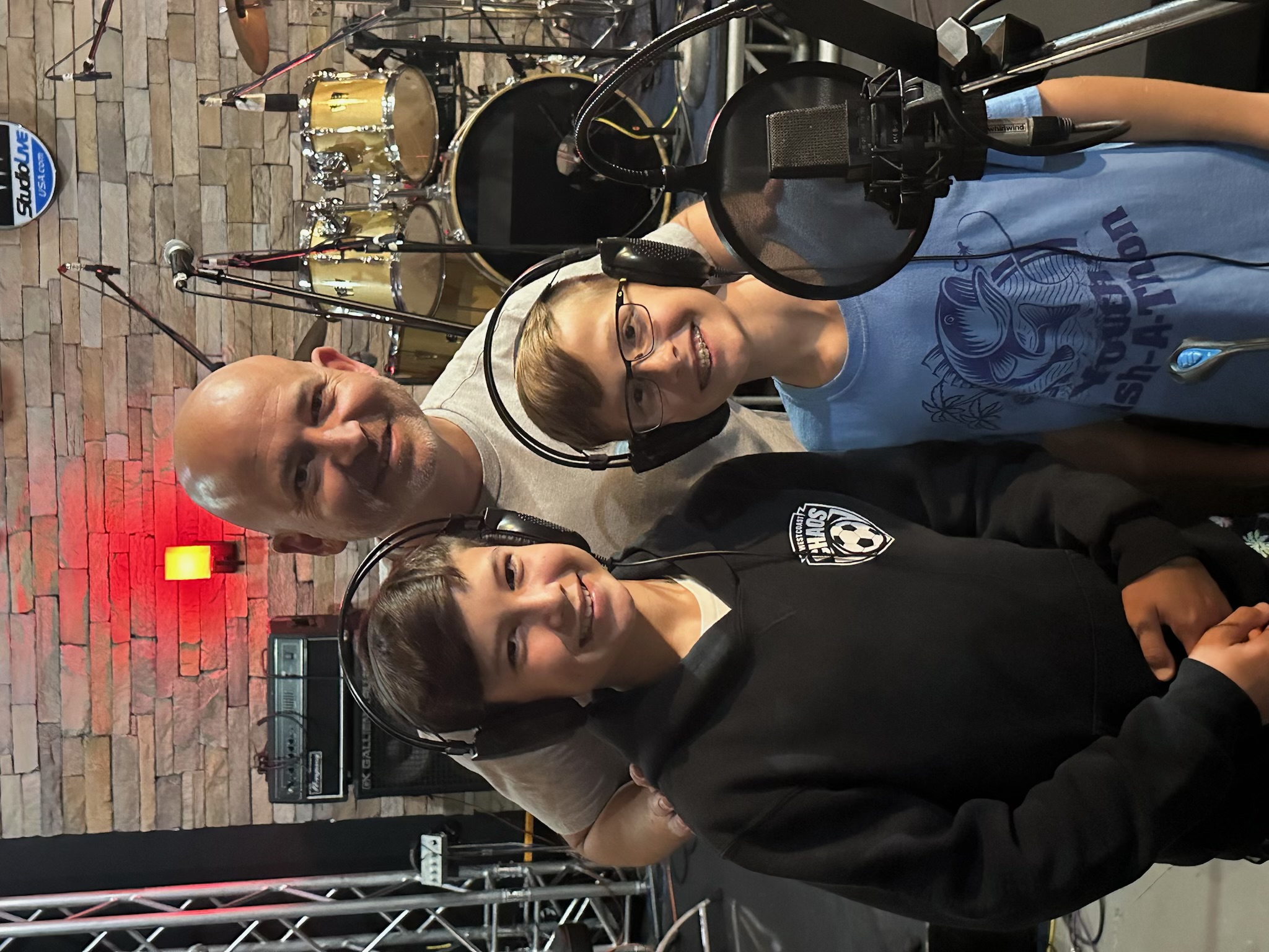 Dave LaGrande working with young musicians in a recording studio