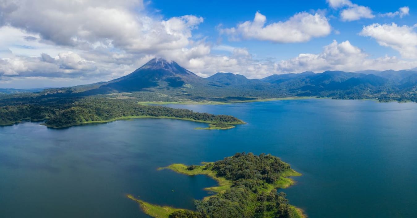 Lake Arenal and the surrounding green hills on the scenic drive from La Fortuna to the Pacific coast