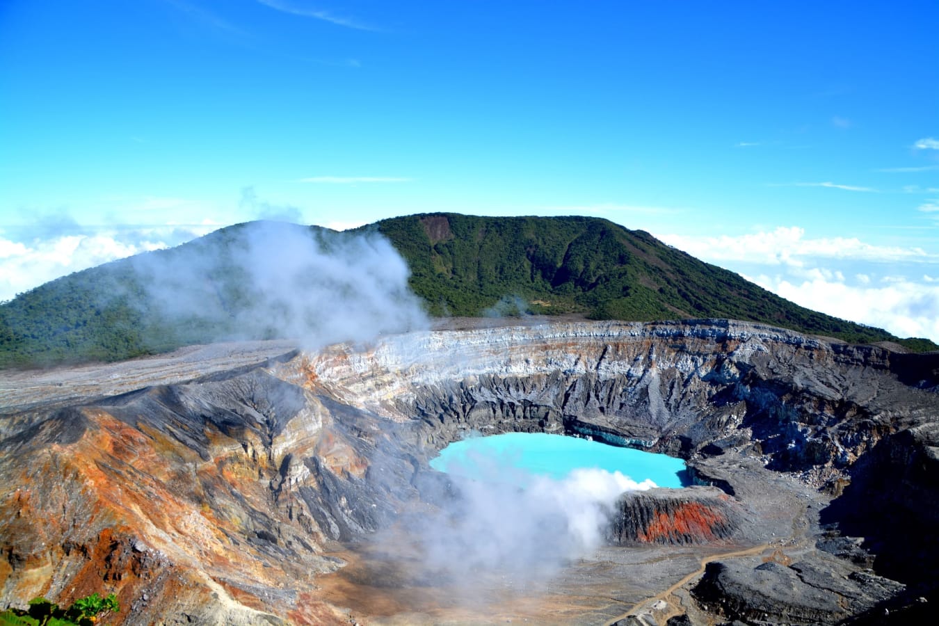 Steaming turquoise crater lake at Poas Volcano in the highlands of Costa Rica