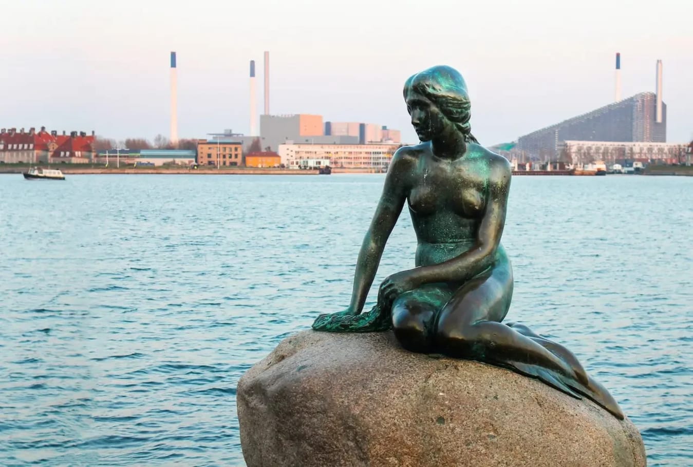 The Little Mermaid statue in Copenhagen Denmark overlooking the harbor