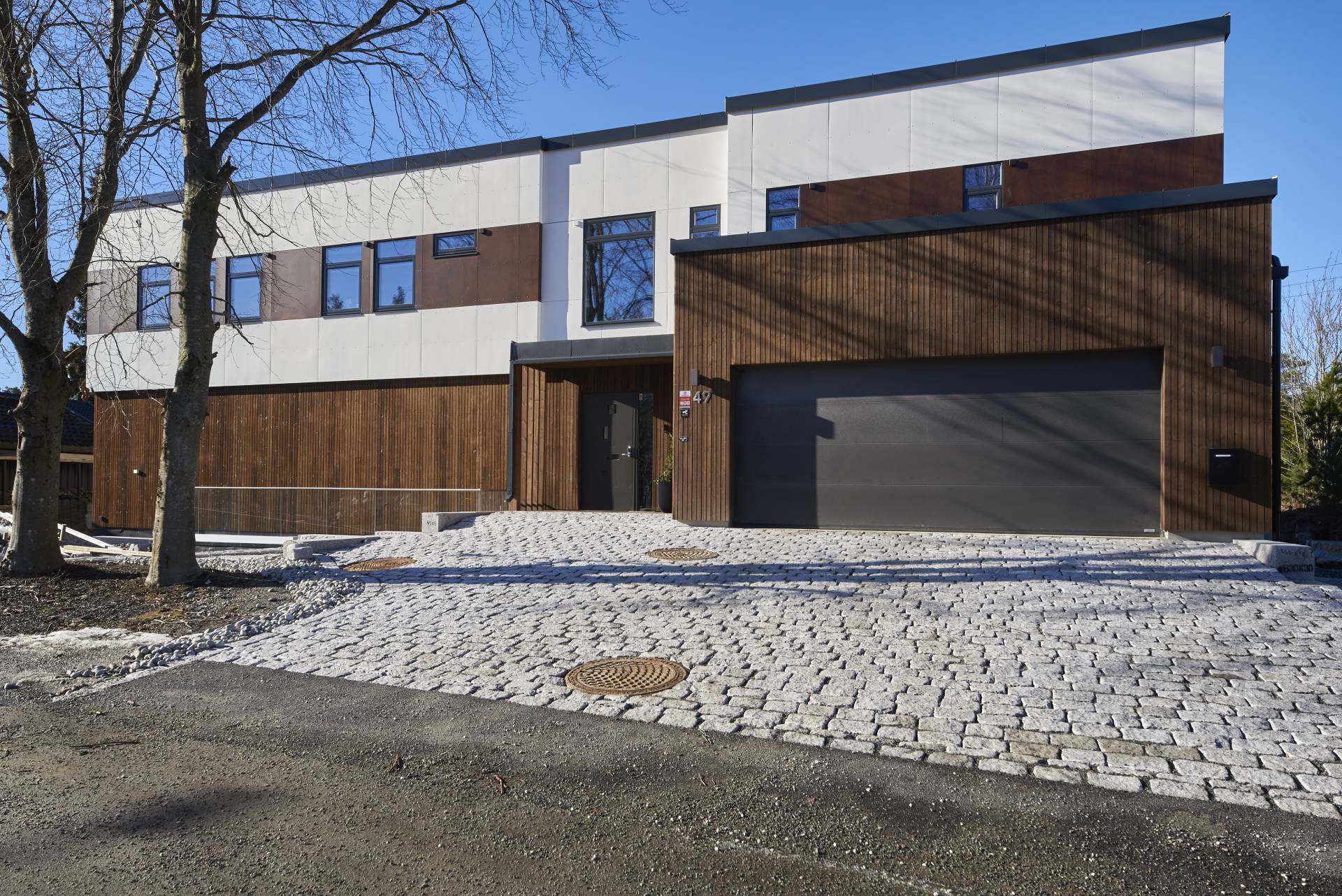 Foto av fasade på enebolig på Sofiemyr i Nordre Follo
