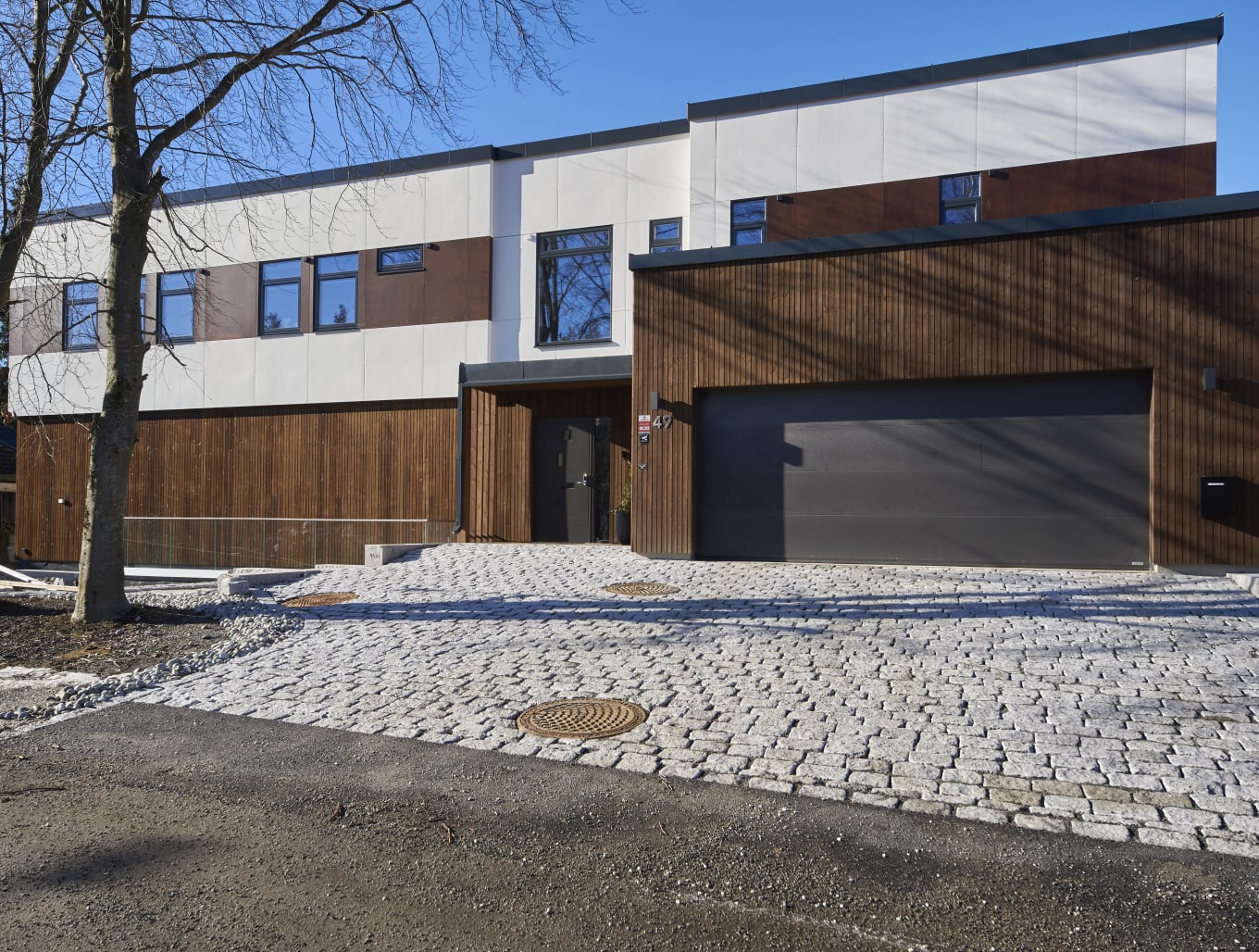 Foto av fasade på enebolig på Sofiemyr i Nordre Follo
