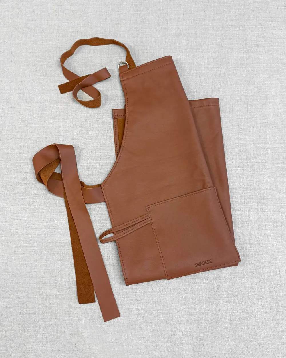 Brunt skinnförkläde