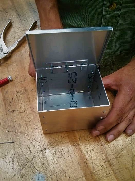 metal box with hinged lid