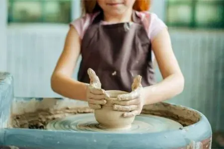 Kids Muddy Pottery Wheel Photo