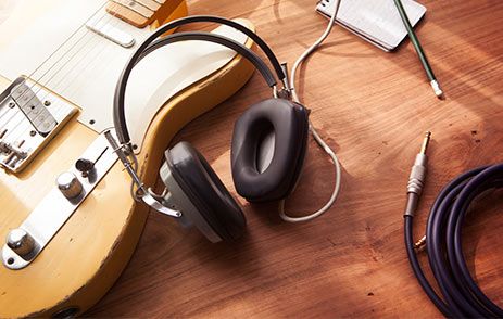 Headphones on table with recording equipment