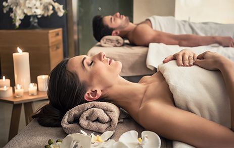 Couple enjoying luxury spa treatment 