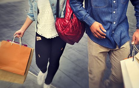 Couple carrying lots of shopping bags