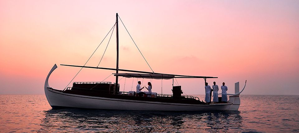 Couple on boat at sunset