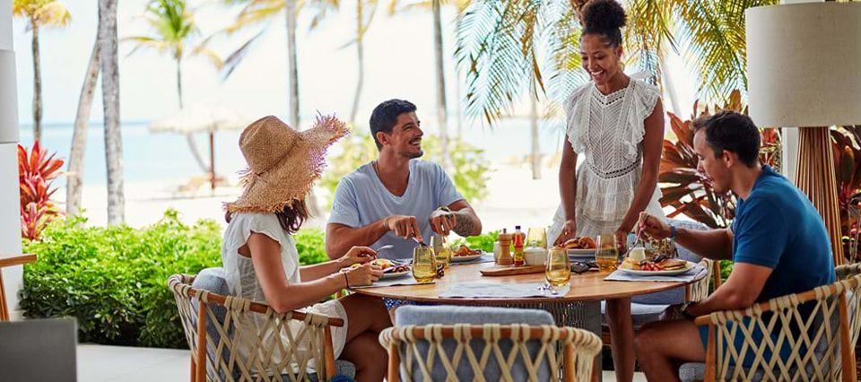 Friends dining at Jumby Bay Island Antigua