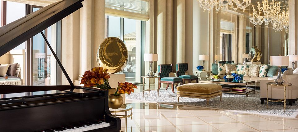 piano and chandeliers in stunning lobby area of hotel