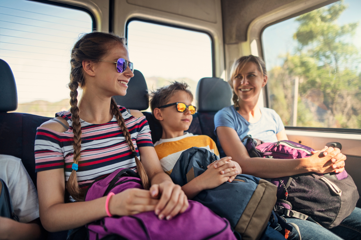 A family on a bus journey on holiday