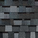 TruDefinition Duration Designer Pacific Wave shingles have an overall color of gray blue that is is achieved by a mix of light gray, dark gray, bright blue, and dark blue granules.