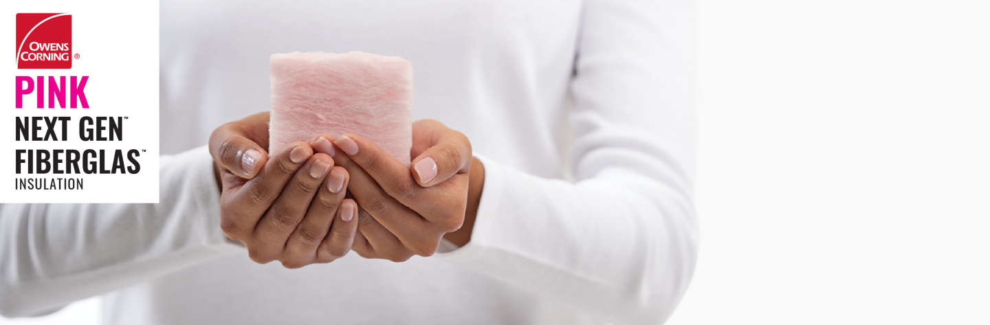 hands holding a small piece of next gen fiberglas