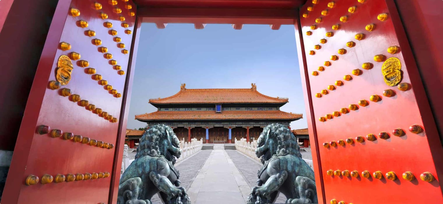 Red entrance gate opening to the forbidden city in Beijing - China