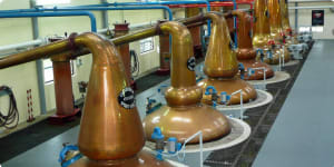 Modern pot stills in a distillery in Scotland