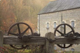 cog wheels, in front of an old Georgian wool mill.